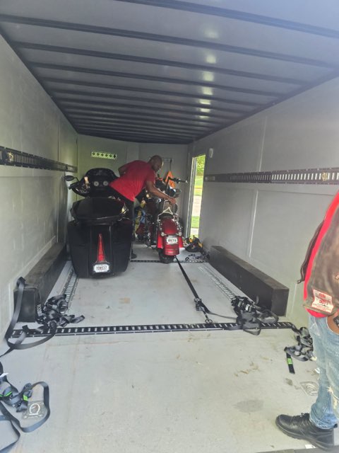 Multiple motorcycles including sport bikes loaded and secured in single trailer